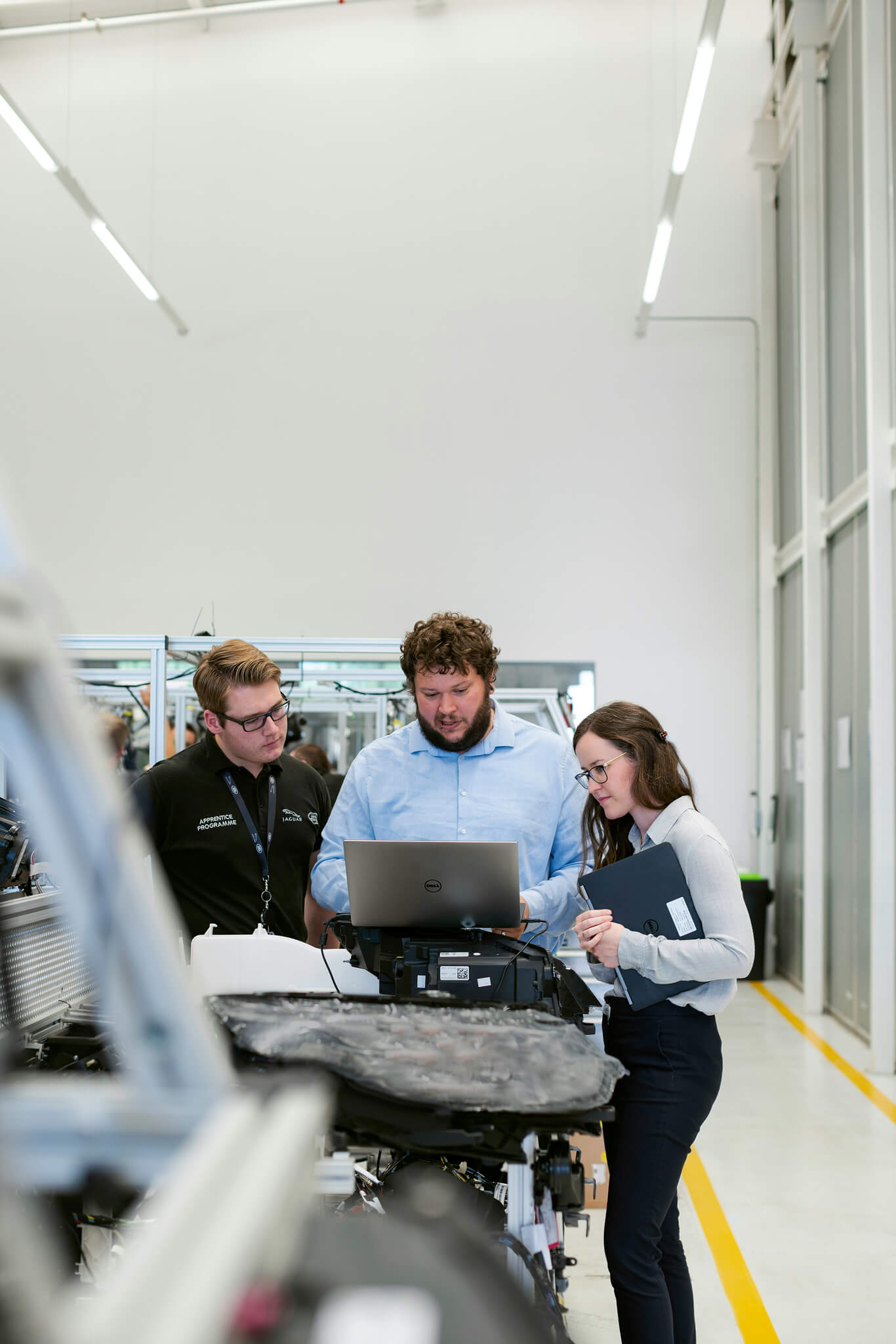Group of colleagues reviewing sustainability tools for small businesses on a computer screen.
